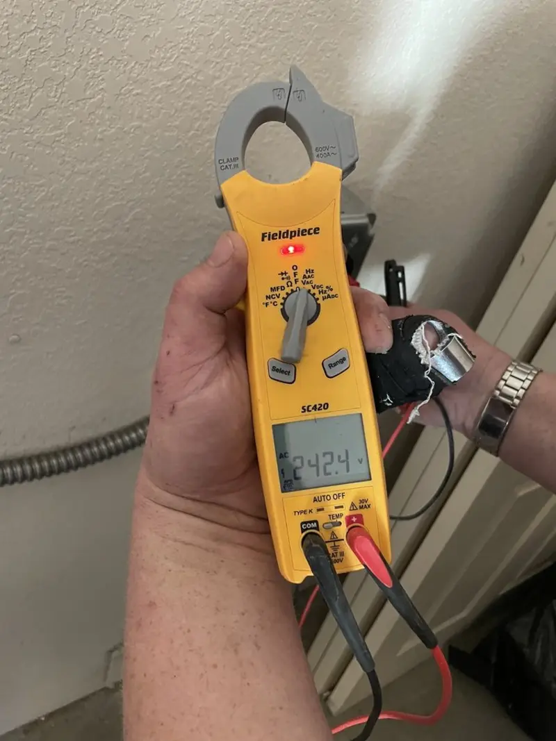 Voltage testing with clamp meter during Circuit Breaker Repair in Sanger